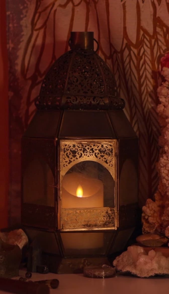 A warm lantern glow that reflects the calm and care of The Lightness of Being.