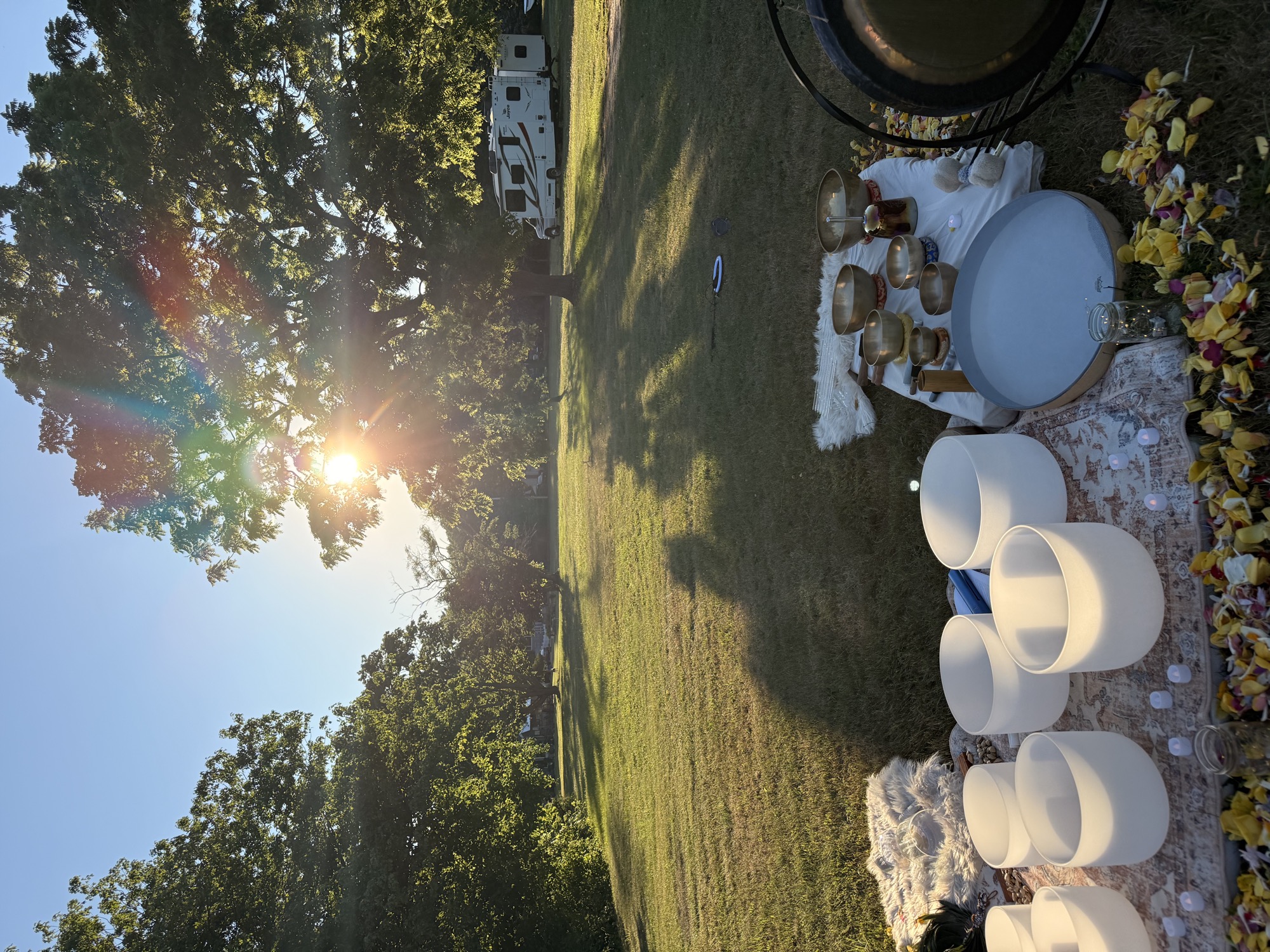 Golden hour sound bath setup beneath the evening sun